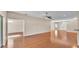 Large living area with hardwood floors, a ceiling fan, and neutral paint at 2812 Whitney St, Lakeland, FL 33813