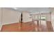 Open-concept living space with hardwood floors connecting the living area at 2812 Whitney St, Lakeland, FL 33813