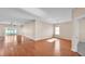 Open living room features hardwood floors, bright lighting, and a door leading to an outdoor patio at 2812 Whitney St, Lakeland, FL 33813