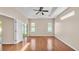 Large main bedroom with hardwood floors, tray ceiling, and sliding door access at 2812 Whitney St, Lakeland, FL 33813
