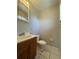 Bathroom featuring a single vanity, mirror, and standard toilet at 29 Coleman Rd, Winter Haven, FL 33880
