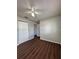 This bedroom offers a closet and dark hardwood floors at 29 Coleman Rd, Winter Haven, FL 33880