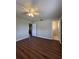 Primary bedroom features hardwood floors and an attached bathroom at 29 Coleman Rd, Winter Haven, FL 33880