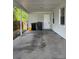 View of covered carport with access door to home's side entrance at 29 Coleman Rd, Winter Haven, FL 33880