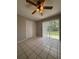 Dining room offers tile floors, a ceiling fan, and sliding glass door to the backyard at 29 Coleman Rd, Winter Haven, FL 33880