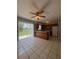 Open concept kitchen with breakfast bar and sliding glass door for backyard access at 29 Coleman Rd, Winter Haven, FL 33880