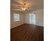 Living room features hardwood floors, a ceiling fan, and natural light from a window at 29 Coleman Rd, Winter Haven, FL 33880