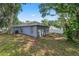 Exterior view of house with a fenced in backyard at 3015 Thornhill Rd, Winter Haven, FL 33880