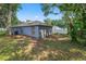 Exterior view of house with a fenced in backyard at 3015 Thornhill Rd, Winter Haven, FL 33880