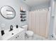 Bathroom with a vanity sink, shelving, and a shower with curtain at 3015 Thornhill Rd, Winter Haven, FL 33880