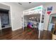 Bedroom with a loft bed, desk, and storage, plus an adjacent bathroom at 3015 Thornhill Rd, Winter Haven, FL 33880
