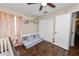 This bedroom features wood floors, closet and a reading nook at 3015 Thornhill Rd, Winter Haven, FL 33880
