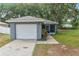 Cozy single-story home with an attached garage and well-kept lawn at 3015 Thornhill Rd, Winter Haven, FL 33880
