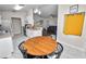 Open kitchen and dining area featuring stainless steel appliances and a wooden table at 3015 Thornhill Rd, Winter Haven, FL 33880