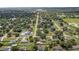 Neighborhood aerial view highlighting mature trees, residential streets, and well-spaced homes creating a peaceful setting at 3560 Sandpiper Ln, Mulberry, FL 33860