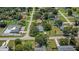 The aerial showcases the property's mature trees and surrounding homes in a well-established neighborhood at 3560 Sandpiper Ln, Mulberry, FL 33860