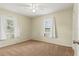 This bedroom has neutral walls, and carpeting and is brightly illuminated by natural light at 3560 Sandpiper Ln, Mulberry, FL 33860