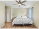 Bright bedroom features neutral walls, carpet, closet, and ceiling fan at 3560 Sandpiper Ln, Mulberry, FL 33860