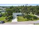 Charming single-Gathering home boasts a well-manicured lawn and mature shade trees, enhancing curb appeal at 3560 Sandpiper Ln, Mulberry, FL 33860