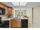 Well-lit kitchen with wooden cabinets, modern appliances, and laminate countertops at 3560 Sandpiper Ln, Mulberry, FL 33860