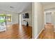 Living room features hardwood floors and sliding doors for natural light at 3560 Sandpiper Ln, Mulberry, FL 33860