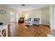 Open-concept living room with laminate flooring, a gray sofa, and plenty of natural light at 3560 Sandpiper Ln, Mulberry, FL 33860