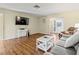 Spacious living room featuring sleek laminate floors, neutral walls, and ample natural light at 3560 Sandpiper Ln, Mulberry, FL 33860