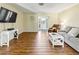 Spacious living room featuring sleek laminate floors, neutral walls, and ample natural light at 3560 Sandpiper Ln, Mulberry, FL 33860