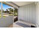 View from the screened-in porch looks out onto a well-manicured lawn at 3560 Sandpiper Ln, Mulberry, FL 33860