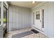 Covered porch features tile flooring and a white front door with glass panels at 3560 Sandpiper Ln, Mulberry, FL 33860
