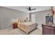 Relaxing bedroom features neutral colors, ceiling fan, and side tables with lamps at 3739 Peregrine Way, Lakeland, FL 33811
