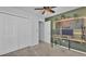 Functional bedroom featuring two closets, a wooden desk, and pegboard wall at 3739 Peregrine Way, Lakeland, FL 33811