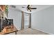 Bright bedroom featuring a ceiling fan, a large window, and a wooden desk at 3739 Peregrine Way, Lakeland, FL 33811