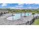 This aerial view showcases the resort-style pool with ample seating and lush landscaping at 3739 Peregrine Way, Lakeland, FL 33811