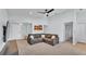 Cozy living room with a comfortable sectional sofa, neutral tones, and an open entryway for a welcoming atmosphere at 3739 Peregrine Way, Lakeland, FL 33811