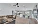 Bright living space with an open floor plan, comfortable seating, and modern kitchen with stainless steel appliances at 3739 Peregrine Way, Lakeland, FL 33811