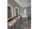 Modern bathroom featuring double sinks and a soaking tub at 3780 Pioneer Trails St, Lakeland, FL 33810