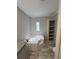 Bright bathroom featuring a soaking tub and linen shelving at 3780 Pioneer Trails St, Lakeland, FL 33810