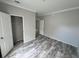 Bright bedroom with hardwood floors and a walk-in closet at 3780 Pioneer Trails St, Lakeland, FL 33810