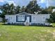 Charming single-story home featuring a well-manicured lawn and a welcoming front entrance at 3780 Pioneer Trails St, Lakeland, FL 33810