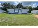 Charming one story home with manicured lawn, and new plantings, creating a welcoming curb appeal at 3780 Pioneer Trails St, Lakeland, FL 33810