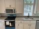 Close-up of updated kitchen with stainless steel appliances and granite countertop at 3780 Pioneer Trails St, Lakeland, FL 33810
