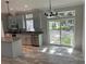 Modern kitchen featuring stainless steel appliances, granite counters, and access to the backyard at 3780 Pioneer Trails St, Lakeland, FL 33810