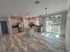 Bright and spacious kitchen with a kitchen island and sliding door that leads to the backyard at 3780 Pioneer Trails St, Lakeland, FL 33810