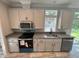 New kitchen with sleek appliances, granite counters, and modern cabinetry at 3780 Pioneer Trails St, Lakeland, FL 33810