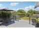 Backyard deck featuring an umbrella, seating, and a view of the grassy yard at 3854 Feather Dr, Lakeland, FL 33812
