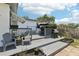 Spacious backyard deck with room to entertain, including an umbrella, seating, and a grill at 3854 Feather Dr, Lakeland, FL 33812