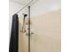 Bathroom shower features a black shower curtain and a useful storage rack at 3854 Feather Dr, Lakeland, FL 33812