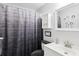 Neat bathroom with a coordinating shower curtain and vanity at 3854 Feather Dr, Lakeland, FL 33812