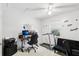 Bedroom designed as a multi-functional space with desk and exercise equipment at 3854 Feather Dr, Lakeland, FL 33812